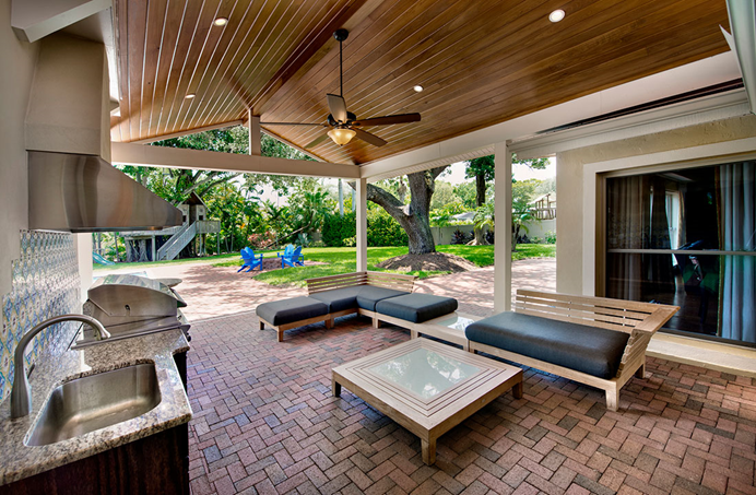 Covered patio with outdoor seating area.