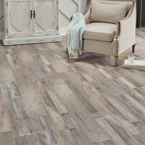 Rustic wood flooring in cozy living space.