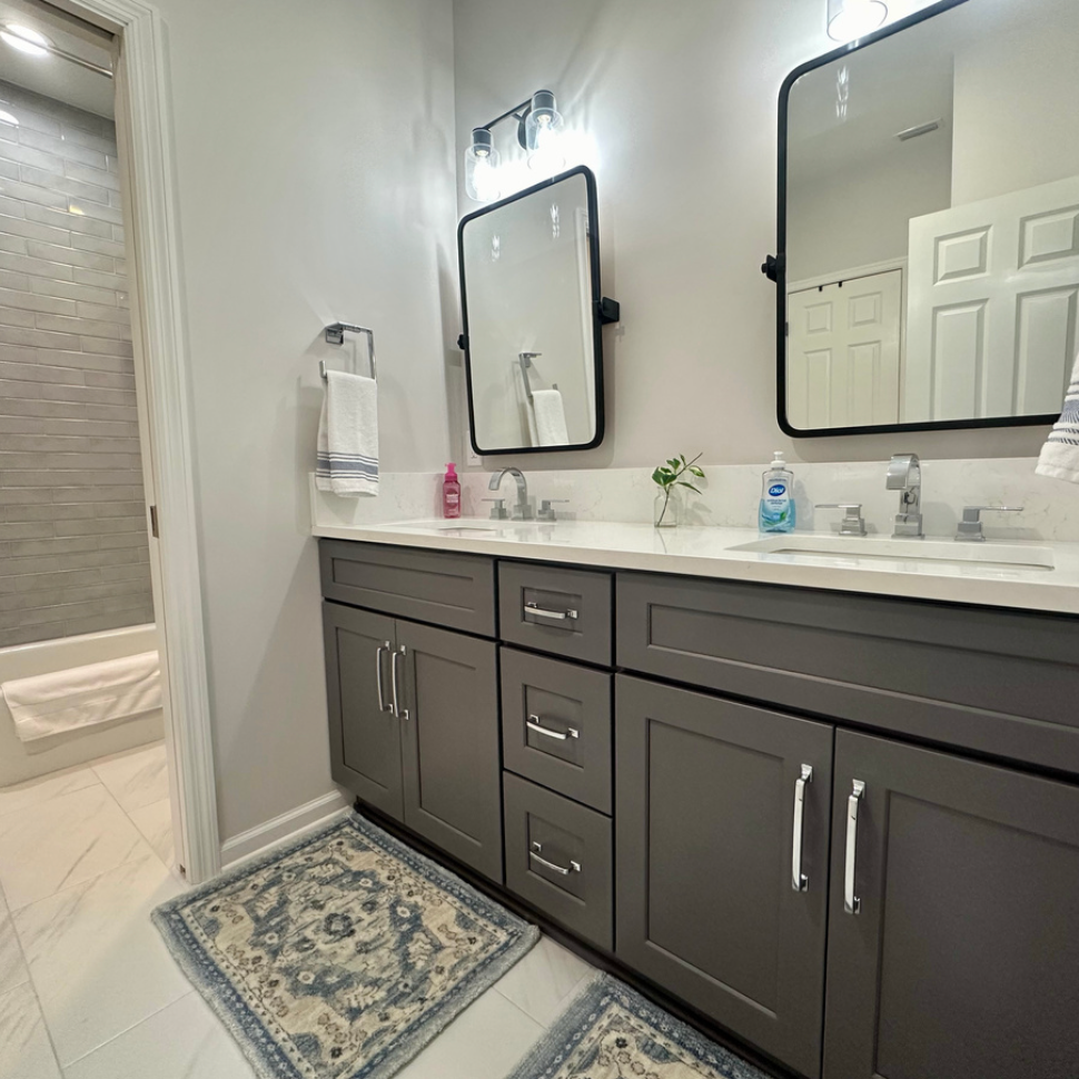 Modern bathroom with double vanity sinks.