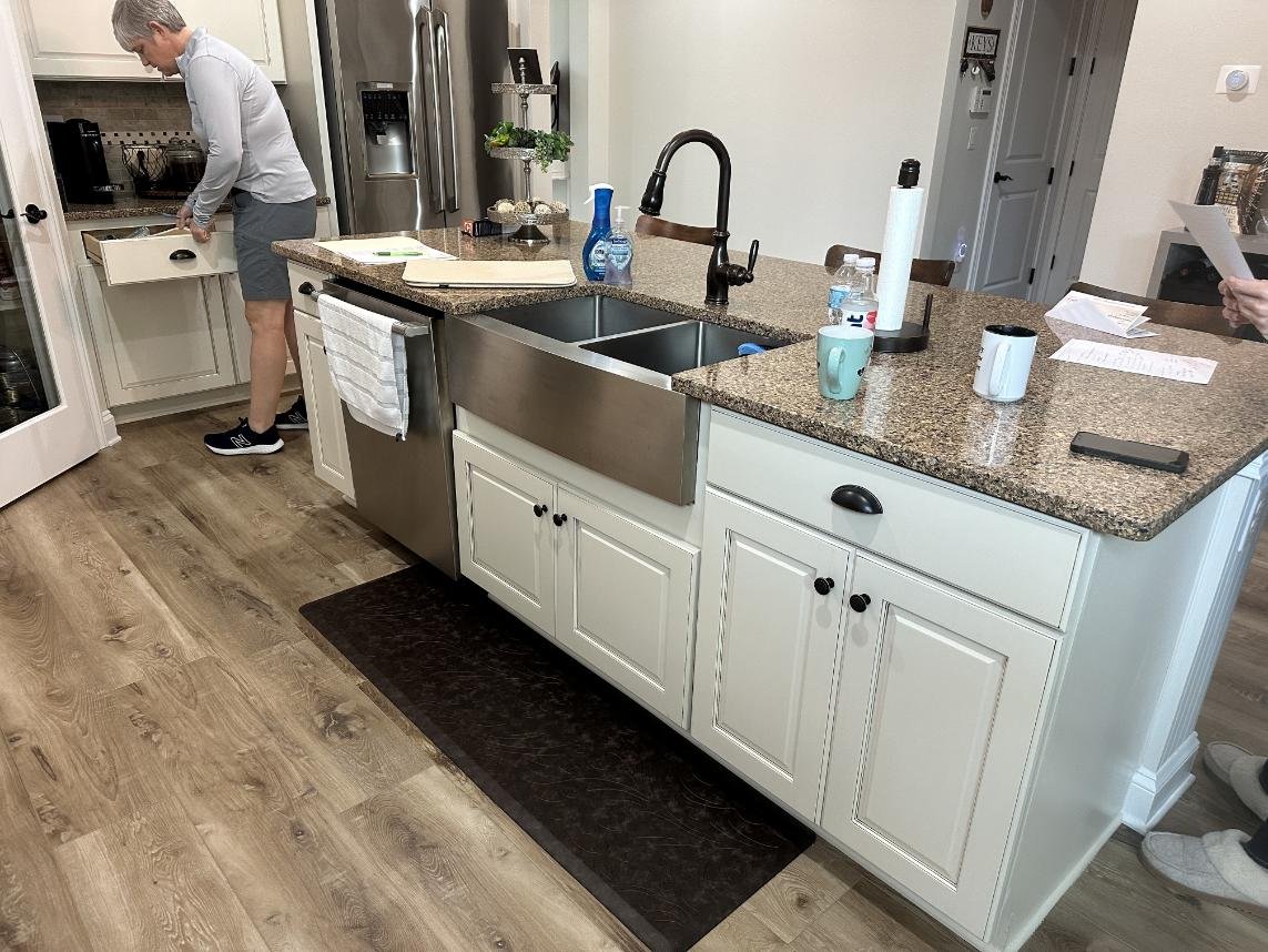 Modern kitchen with island and appliances.
