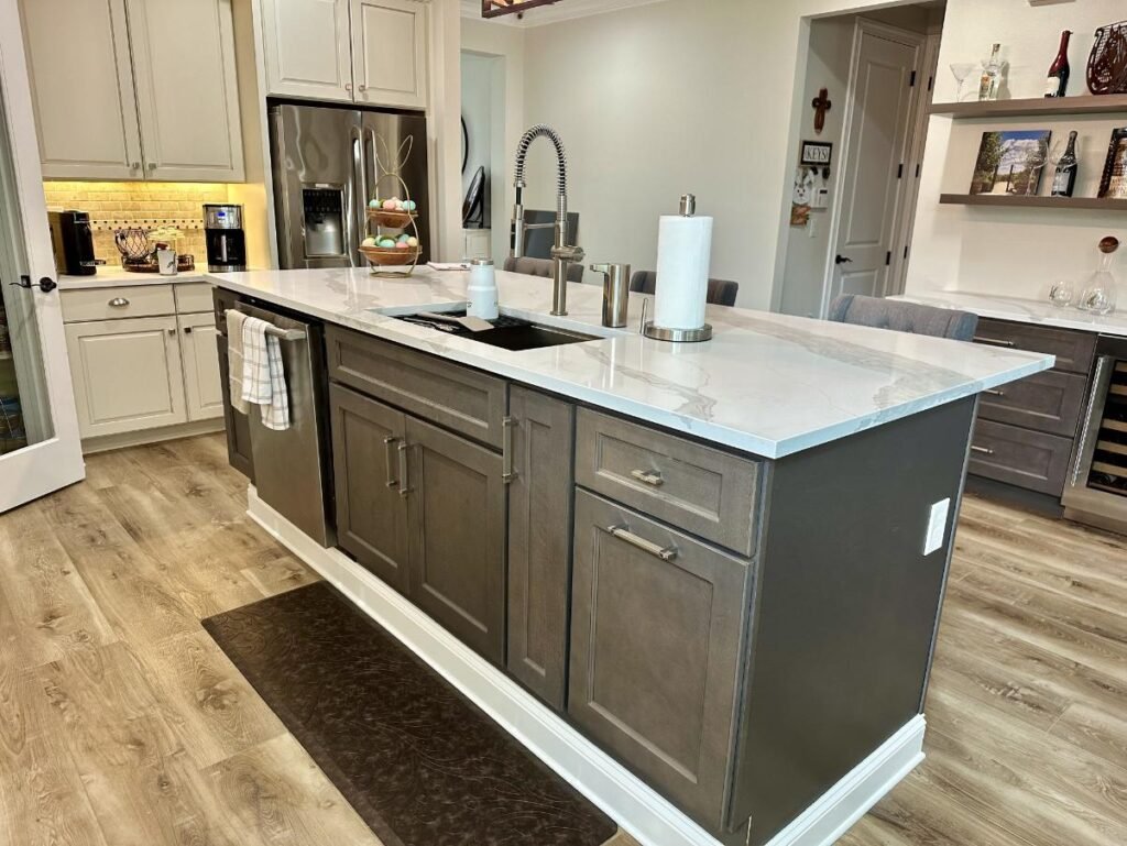 Modern kitchen with island and sink unit.