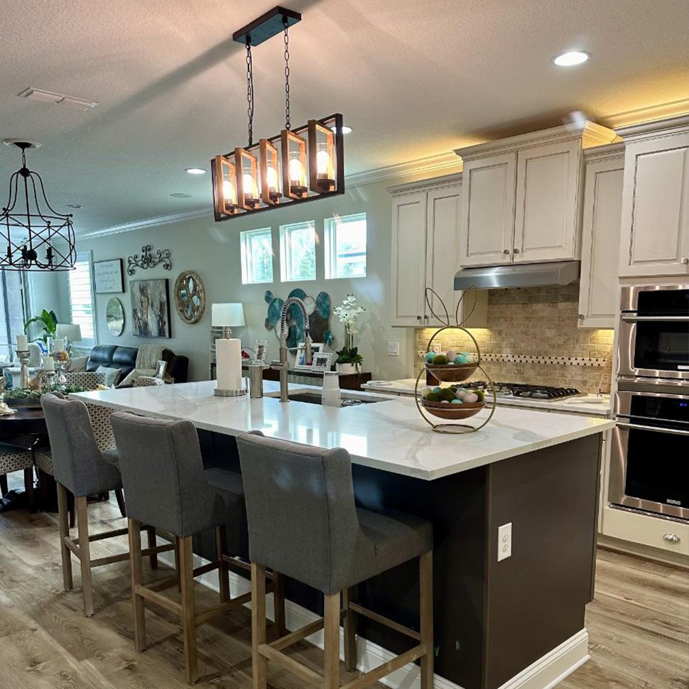 Modern kitchen with island and seating.