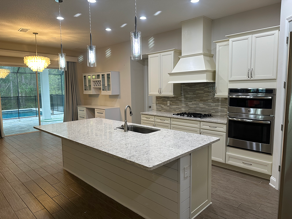 Modern kitchen with white cabinetry.