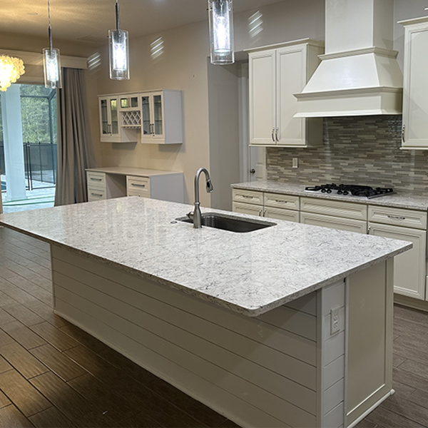 Modern kitchen with marble island and decor