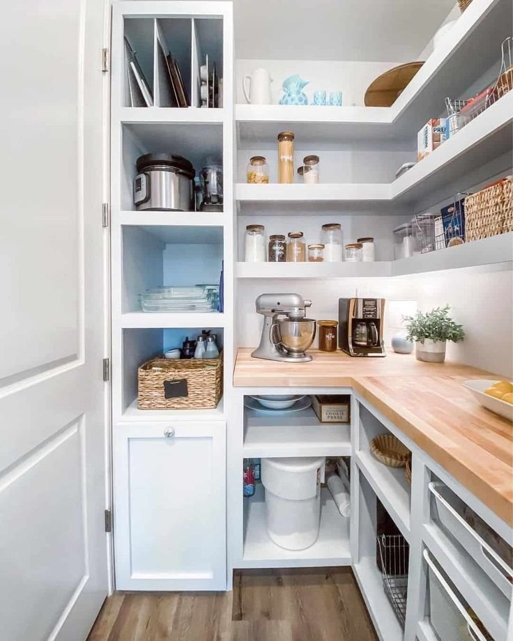 Organized pantry with shelves and kitchen tools.